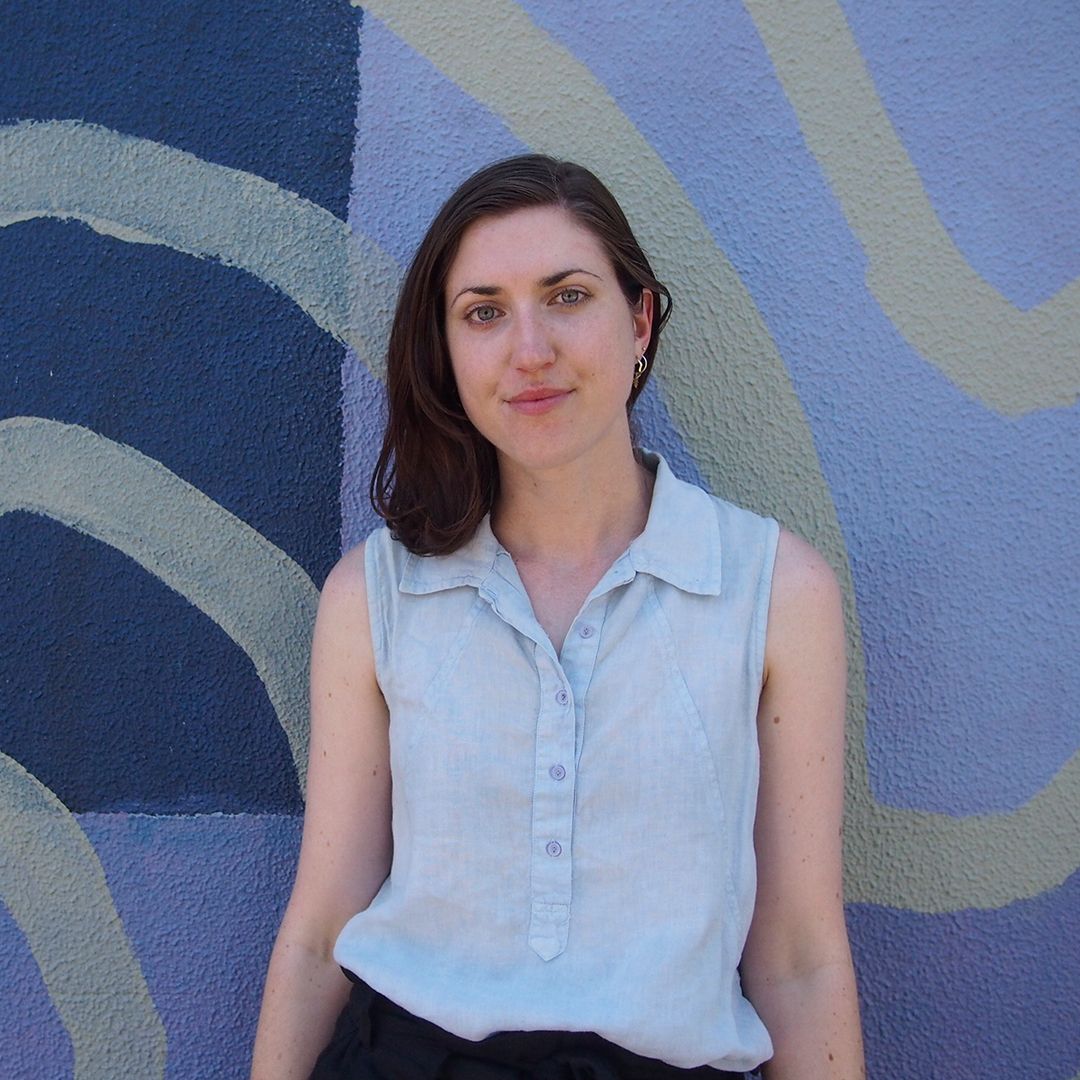 Blue swirley background with women with brown hair in blue shirt 